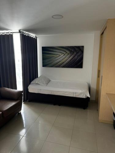 Postel nebo postele na pokoji v ubytování Elegante y Confortable Suites