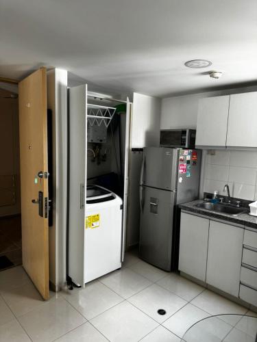 Kuchyň nebo kuchyňský kout v ubytování Elegante y Confortable Suites