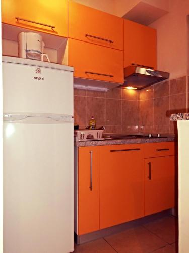 Cuisine ou kitchenette dans l'établissement Apartmani Šimić