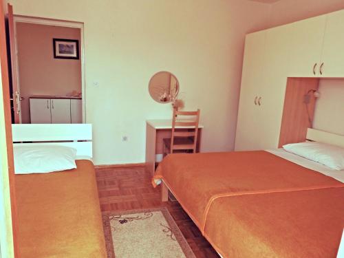 Un ou plusieurs lits dans un hébergement de l'établissement Apartmani Šimić