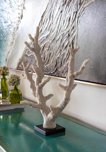 a white tree statue sitting on top of a table at Casa Cielo 3 BR Penthouse with Views in La Romana