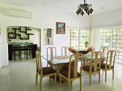 a dining room with a table and chairs at Villas Montserrat Wellness Center in Guadalupe