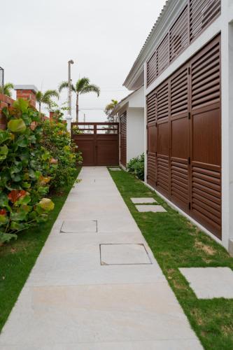 a walkway in front of a house at Casa Grace Olón in Olón