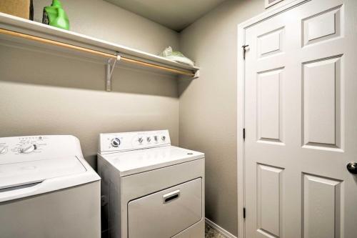 a small kitchen with a stove and a washer at Family Friendly Playroom Garage in Caldwell