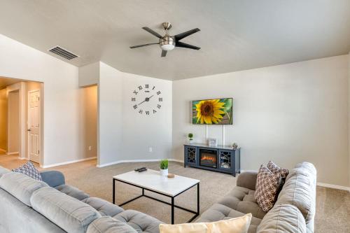 a living room with a couch and a clock on the wall at Family Friendly Playroom Garage in Caldwell
