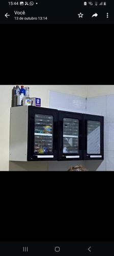 a picture of two windows in a room at Apartamento no Murubira in Chapéu Virado