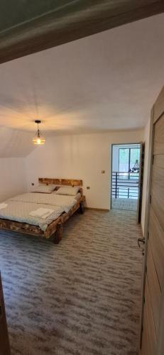 Ένα ή περισσότερα κρεβάτια σε δωμάτιο στο The Nest on the Hill