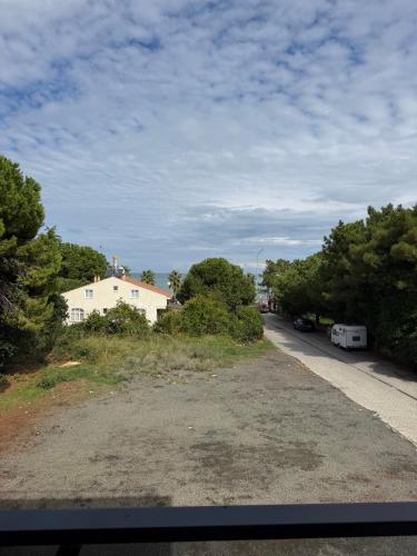 a view of a road with a house and trees at Deluxe Beach Residence in Samsun