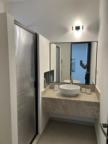 a bathroom with a sink and a mirror at Casa Mujer Ceiba - Indoor Pool - We Invoice in Tierra Colorada
