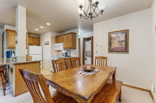 a kitchen and dining room with a wooden table at The Great Escape in McCall