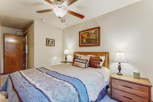 a bedroom with a bed and a ceiling fan at The Great Escape in McCall