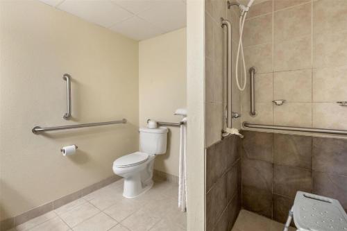 a bathroom with a toilet and a shower at SureStay Plus Hotel by Best Western Litchfield in Litchfield