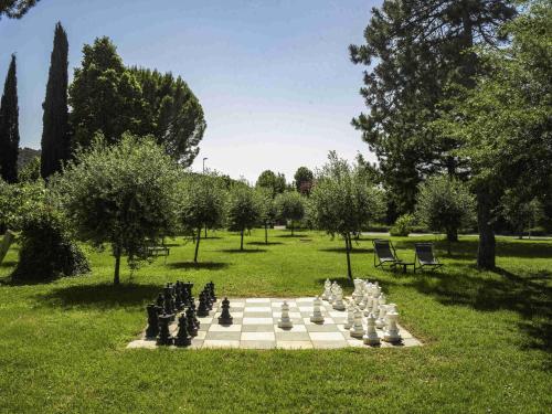 a chess board on the grass in a park at ibis Aix en Provence in Aix-en-Provence
