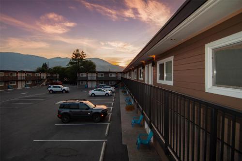a balcony with a car parked in a parking lot at Coast Penticton Hotel in Penticton