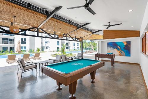 a pool table in the middle of a room at Contemporary Viva Jaco Residences Suite with Pool in Jacó