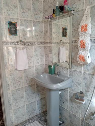 a bathroom with a sink and a mirror at Fontinele's Home Apt 201 in Nova Iguaçu