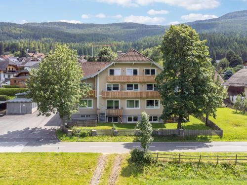 a large house with trees in front of it at Eden Kleinbichl Top 7 in Tamsweg