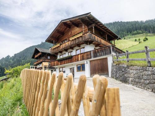 a wooden fence in front of a house at Tirola Chalet Alpbach in Alpbach