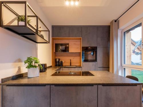 a kitchen with a sink and a counter top at Mountain Chalet Aquarius 5A in Sankt Lorenzen ob Murau