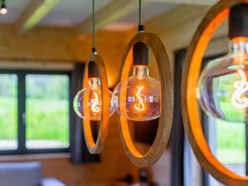 a group of lights hanging from a ceiling at Obermöschach 13 in Obermöschach