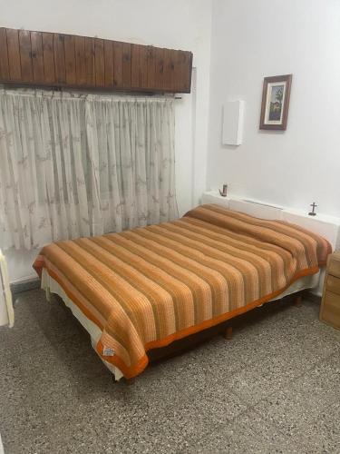 a large bed in a room with a window at Business Home in Olivos