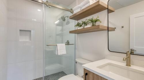 a bathroom with a shower and a toilet and a sink at 1115 Aerie Buyout 2 Units Near Downtown Hot Tub Mountain View in Bend