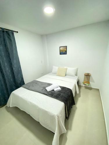 Ένα ή περισσότερα κρεβάτια σε δωμάτιο στο Casa moderna en el centro Carmen V WI-FI