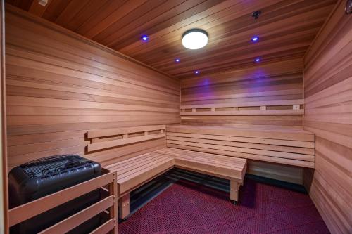a wooden sauna with a black suitcase in the middle at Mountain View Condo Near Beach with Free Parking! in Honolulu
