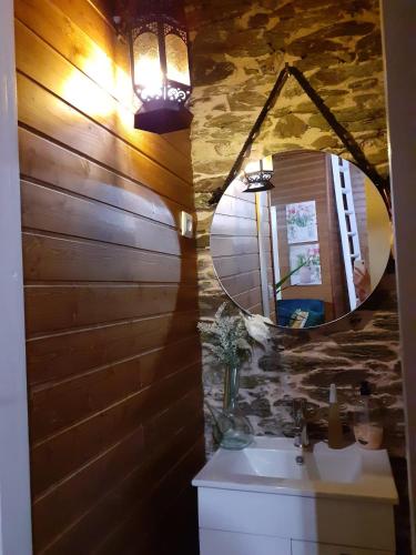a bathroom with a sink and a mirror at Casa do Vale Encantado in Cedovim