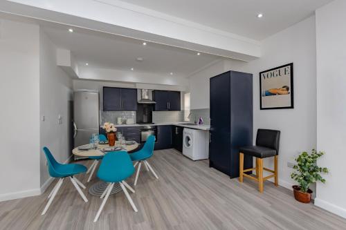 a kitchen and dining room with a table and chairs at Triple B Aparto in Clacton-on-Sea