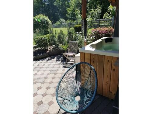 a blue fan sitting on a patio next to a sink at Julia and Markus Sitzmann in Bischofsheim an der Rhön