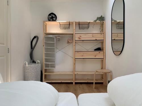 a room with a closet with a mirror at Holiday Home in Petten near the Beach in Sint Maartensvlotbrug