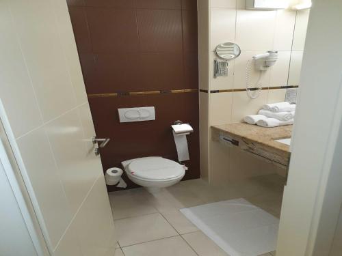 a bathroom with a toilet and a sink at Marina Portoro Family Friendly Apartment 4 - Two Bedroom Apartment in Lucija