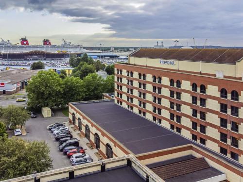 an aerial view of a hotel with a parking lot at Novotel Southampton in Southampton