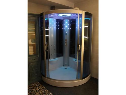 a shower in a bathroom with a glass door at One-bedroom apartment in Waterakkers