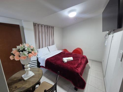 Un televizor și/sau centru de divertisment la EGIPTO HOSTAL Sede Cerro Colorado