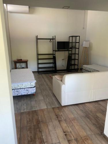 a living room with two beds and a couch at Quinta el roquedal in Baradero