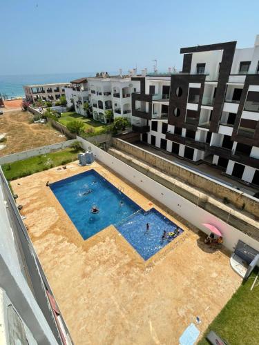 an overhead view of a building under construction with a swimming pool at Studio Près de la mer in Marina Smir