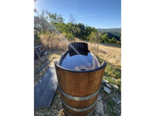 a barrel fire pit in a field at Pas de Baoussac in Salayrac