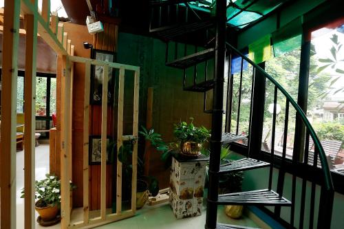 a staircase in a house with potted plants at Shangrila Boutique Hotel in Kathmandu