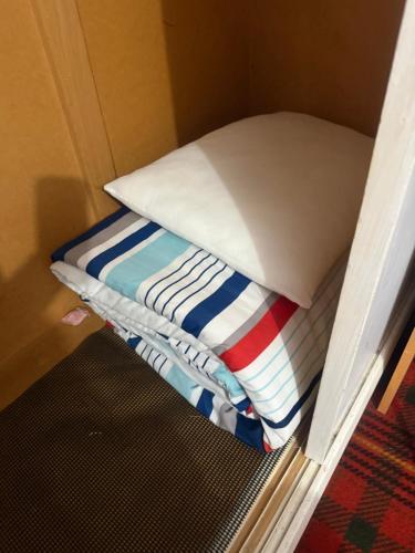 Una cama o camas en una habitación de ADA Homestay