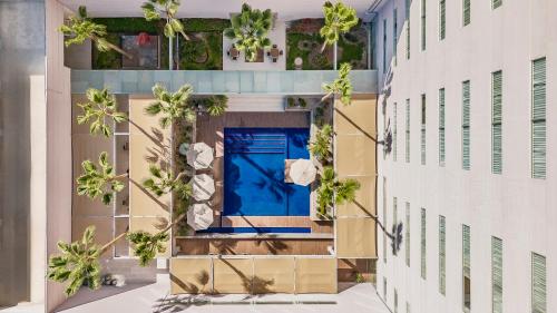an aerial view of a building with a blue door at Fiesta Inn Torreon Galerias in Torreón