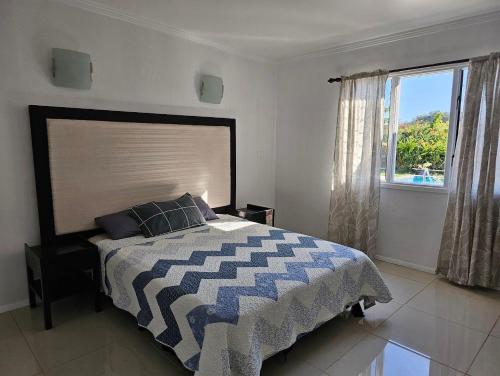 Ένα ή περισσότερα κρεβάτια σε δωμάτιο στο Yadua Bay Holiday Homes