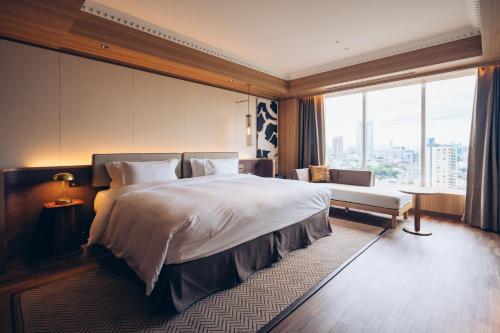 a hotel room with a large bed and a window at The Prince Park Tower Tokyo - Preferred Hotels & Resorts, LVX Collection in Tokyo