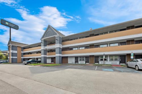 an empty parking lot in front of a building at MainStay Suites Knoxville - Cedar Bluff in Knoxville