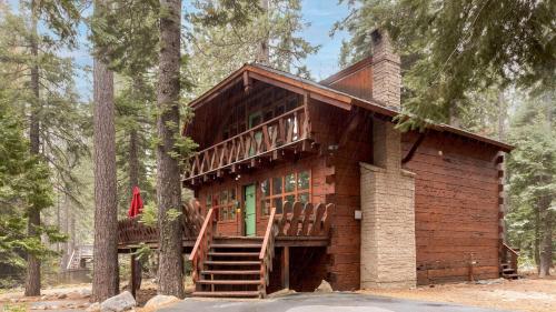 a log cabin in the woods with a deck at Sunnyside by AvantStay Charming Lake Tahoe Chalet on Tahoes West Shore in Tahoe City