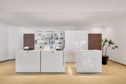 a room with two white refrigerators in a room at Fiesta Inn Insurgentes Sur in Mexico City