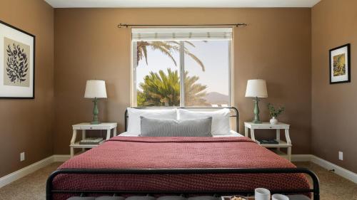 a bedroom with a bed and a large window at Sangiovese By AvantStay Spectacular Estate w Pool Hot Tub Putting Green in Temecula