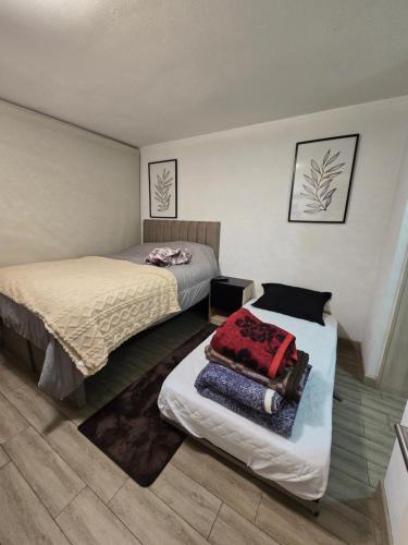 Postel nebo postele na pokoji v ubytování Tranquilidad y comodidad en la ciudad
