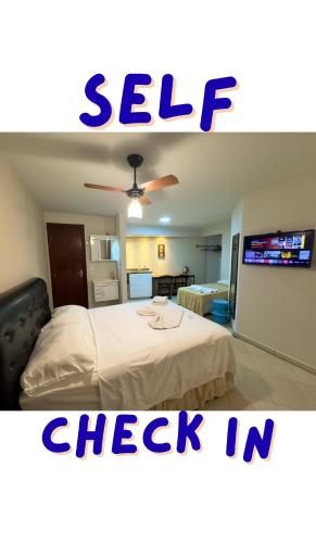 a bedroom with a bed with a sale check in sign at VA Apart Hotel Savassi in Divinópolis